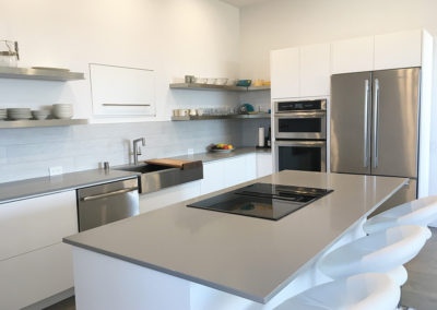 Thin Light Grey Countertop With Modern Stovetop