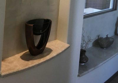 Granite Countertop For Art Vase Sculptures In A Hallway