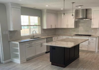 Kitchen With Grey Quartzite Countertop And Island