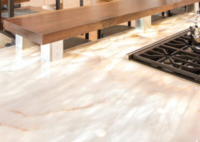 Cream Colored Quartzite Kitchen Countertop With Built In Range Stove